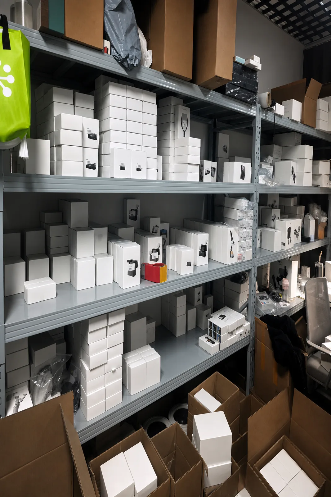 Steel shelving in the stock room, filled with boxed gimbals, cameras and accessories